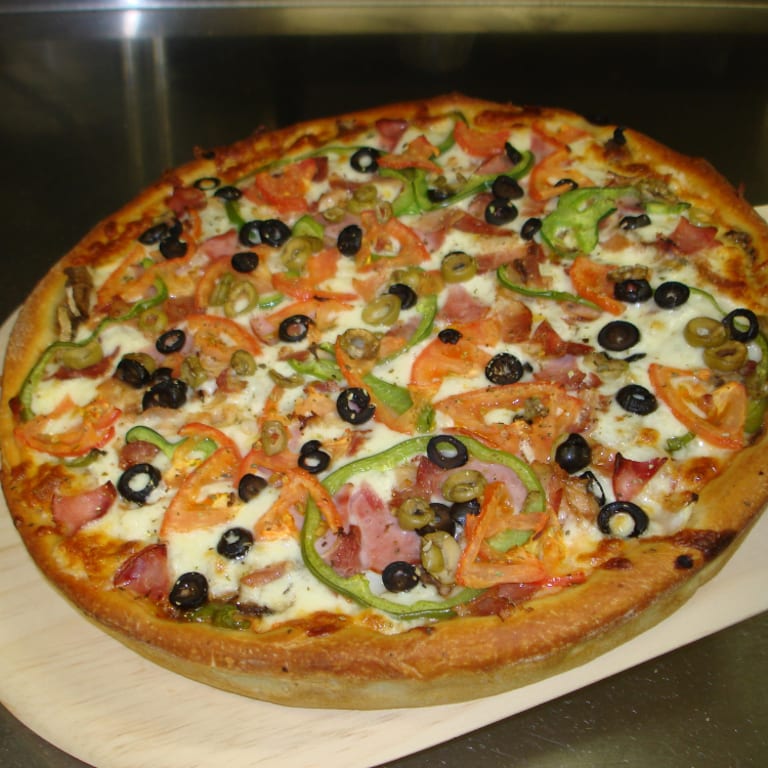 Hand-Crafted Pizzas Baked with 50 years of Tradition